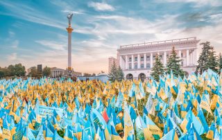 KYIV, UKRAINE - August 23, 2022: Independence Square, with yellow and blue flags, in memory of the fallen defenders of Ukraine during wartime in Ukraine